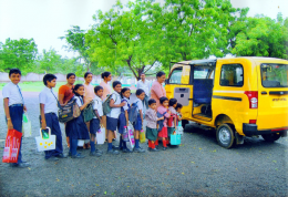 Image of children with the school buss